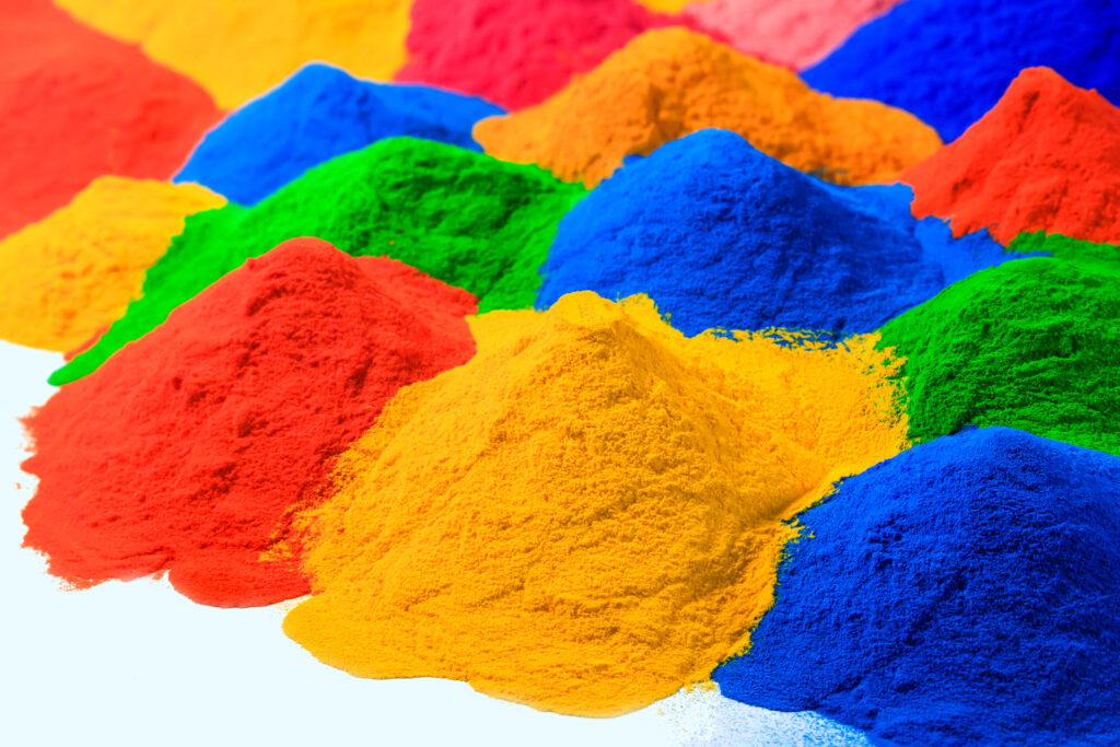 powder coating image Brightly covered powder coating resins ready to be applied to a material for curing