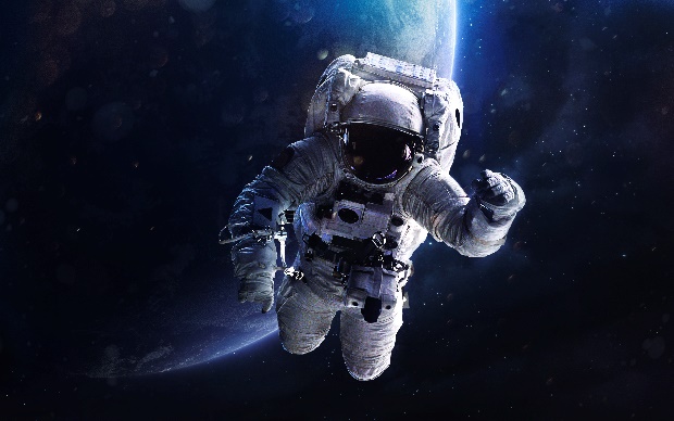 astronaut on a spacewalk An astronaut on a spacewalk with Earth in the background. Innovation in manufacturing with the help of companies like PQ Ovens will help make space more accessible.